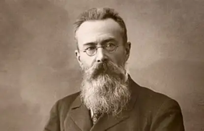 Photo of a middle-aged man with a glasses and a long, bushy beard from the end of the nineteenth century